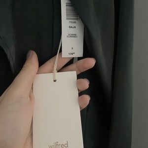 long-sleeve, mock-neck dress with a thigh slit